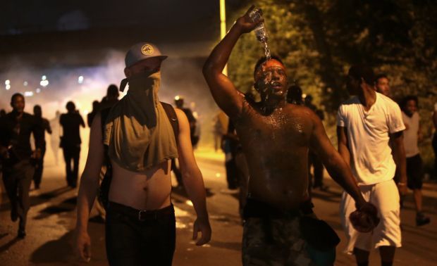 Tear gas fired as marchers moved toward police command post